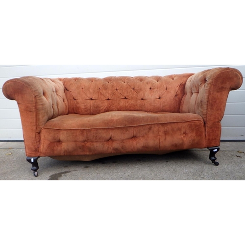 754 - A button upholstered Chesterfield sofa with drop arm, a/f