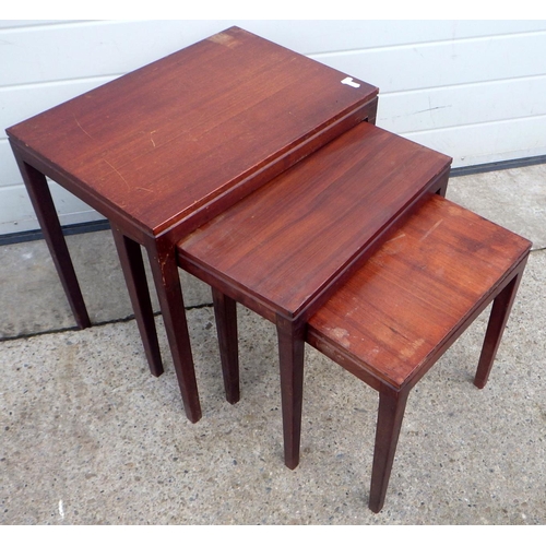 778 - A nest of three teak occasional tables, marks