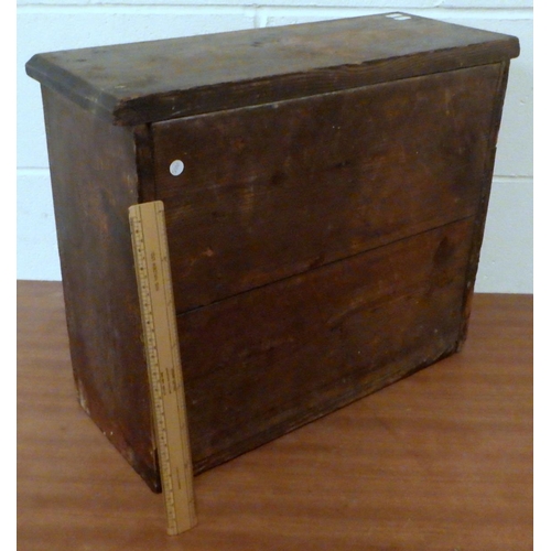 812 - A miniature chest of drawers