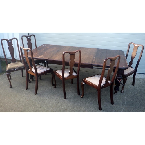 827 - A late Victorian walnut wind out dining table with two leaves, canted corners on reeded legs, 236cm ... 