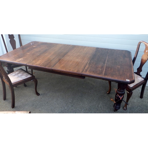 827 - A late Victorian walnut wind out dining table with two leaves, canted corners on reeded legs, 236cm ... 