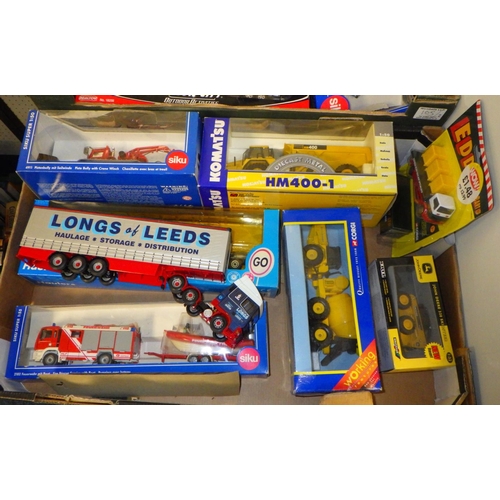 105 - Two boxes of Trucks and trailers etc most boxed
All models have been out of the boxes and used, sold... 