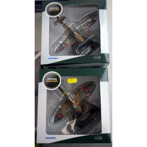 129 - Two Corgi Aviation Archive planes together with two Oxford planes and a HM plane (5) 
All models hav... 