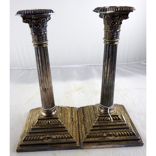 167 - A pair of Silver plated Corinthian column candlesticks 27cm tall