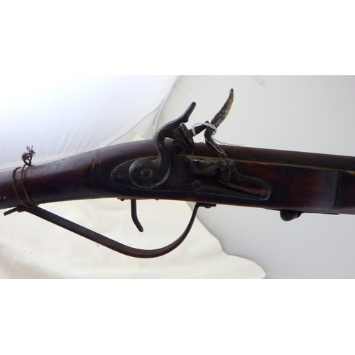 259 - Two India Trade type flintlock guns. Decorative use only.  A/F