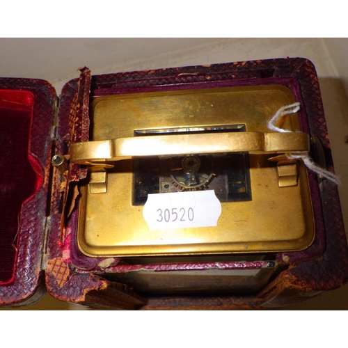 293 - A Brass cased carriage clock in original carry case