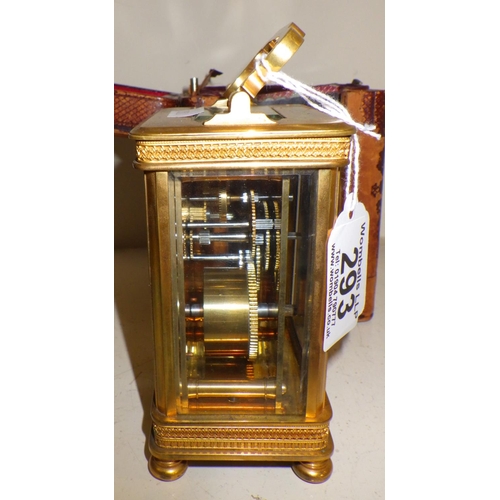 293 - A Brass cased carriage clock in original carry case