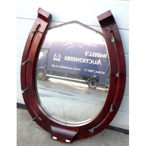 765 - A horse shoe wall mirror