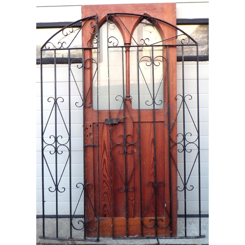 768 - A cast iron gate 124cm wide together with a pitch pine door