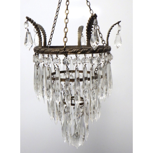 784 - A three tier crystal glass chandelier
The Estate of Mr Darrell Buttery