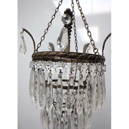 784 - A three tier crystal glass chandelier
The Estate of Mr Darrell Buttery