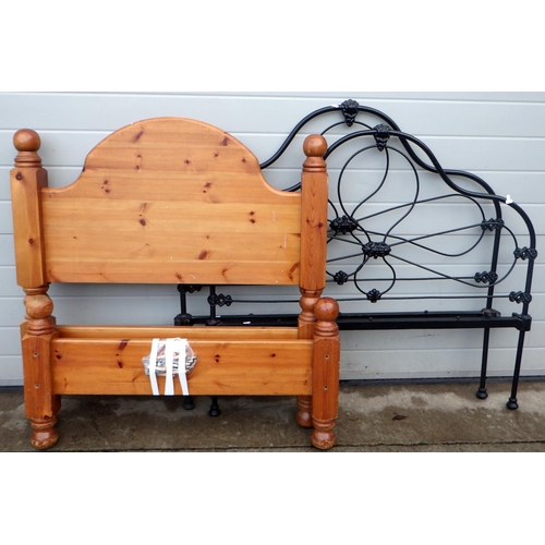 799 - A pine single bed frame together with a further cast iron 4ft bed frame (2)