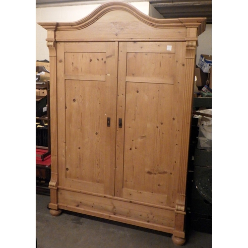 810 - A Continental pine wardrobe 155cm wide