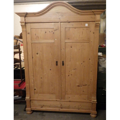 810 - A Continental pine wardrobe 155cm wide