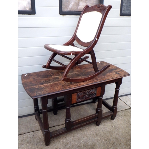 818 - A 19thC converted oak table together with a folding rocking chair (2)