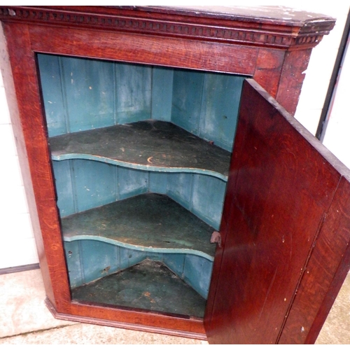 830 - A 19thC oak hanging corner cupboard 107cm high