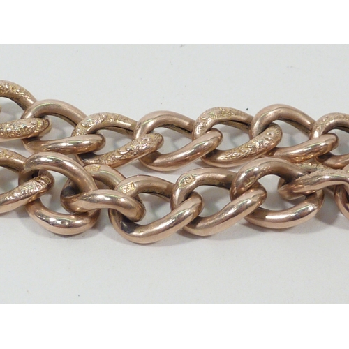 11 - A yellow metal bracelet, the padlock and links marked 9ct.  Approx 190mm long.
11g, elephant base me... 