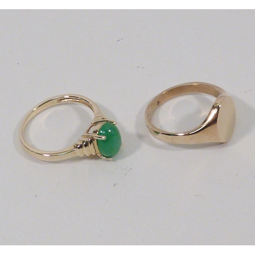 13 - A 9ct gold signet ring, 3gr; a ring set with a green stone, yellow metal marked 14k. (2)