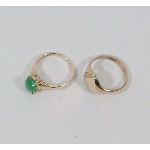 13 - A 9ct gold signet ring, 3gr; a ring set with a green stone, yellow metal marked 14k. (2)