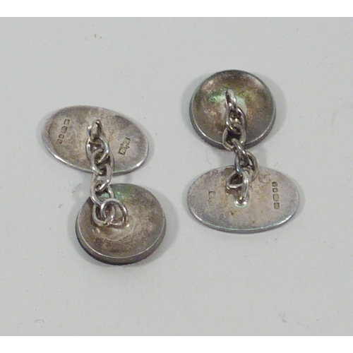 22 - A pair of silver chain link cufflinks bearing a pegasus motif design - possible York Merchant Advent... 