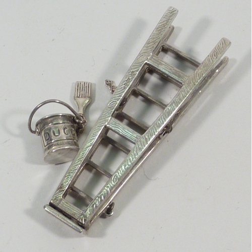 25 - A novelty miniature step ladder, silver later 20th cent, 72mm tall; a Cries of London miniature figu... 