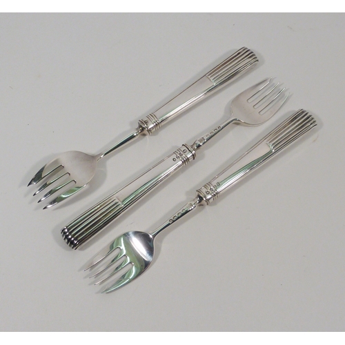 6 - A set of six Victorian silver cake forks, cased.  Each 140mm long; pair of silver salad servers, ear... 