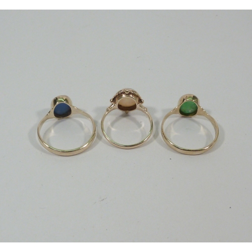 9 - An opal doublet ring, 9ct gold, head 12 x 11mm; two 9ct gold rings of similar design, both stone set... 