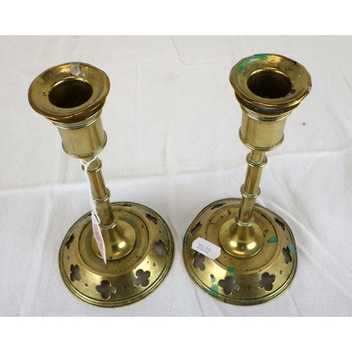 152 - A pair of Gothic revival brass candlesticks 19cm tall