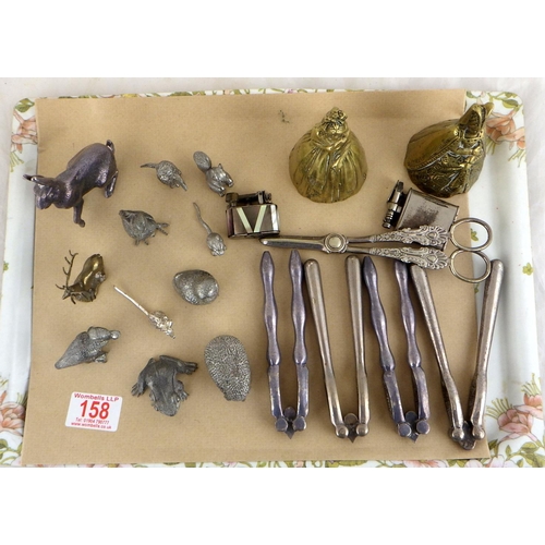 158 - A group of silver plated animals, nutcrackers, two brass bells etc