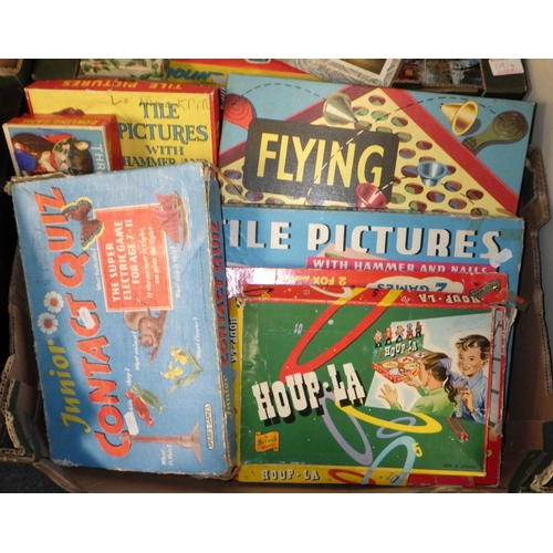 219 - A vintage toy shop, children's fancy dress together with two boxes of misc games & jigsaws AF (4)