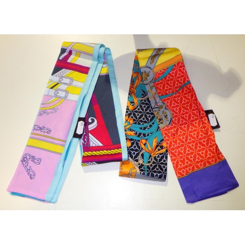 555 - Two Twilly scarves, both bearing Hermes Paris labels.