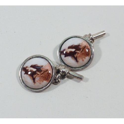 65 - A pair of chain link cufflinks, white metal marked 925 set with porcelain plaques depicting female n... 