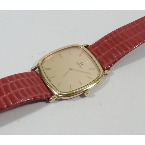 67 - An Omega Deville wristwatch having an Omega movement in a slim gold plated tonneau case (A/F -  crow... 