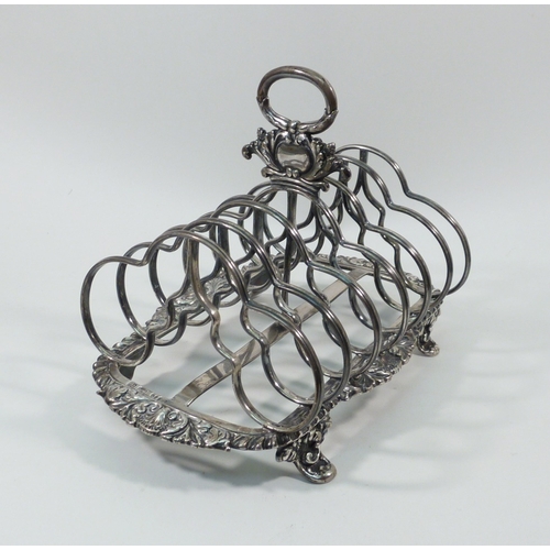 77 - A William IV silver toast rack, Howard, Battie & Hawksworth, Sheffield 1829.  Approx 180mm long/ 140... 