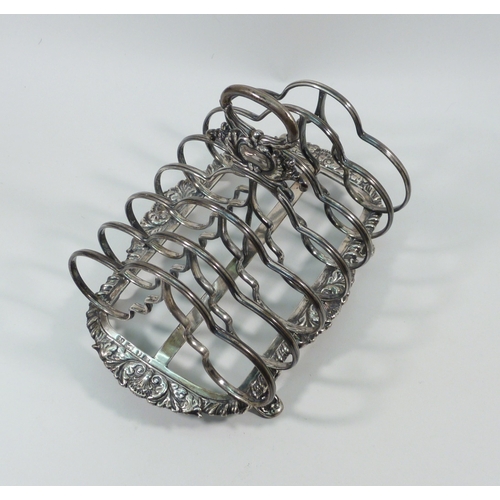 77 - A William IV silver toast rack, Howard, Battie & Hawksworth, Sheffield 1829.  Approx 180mm long/ 140... 