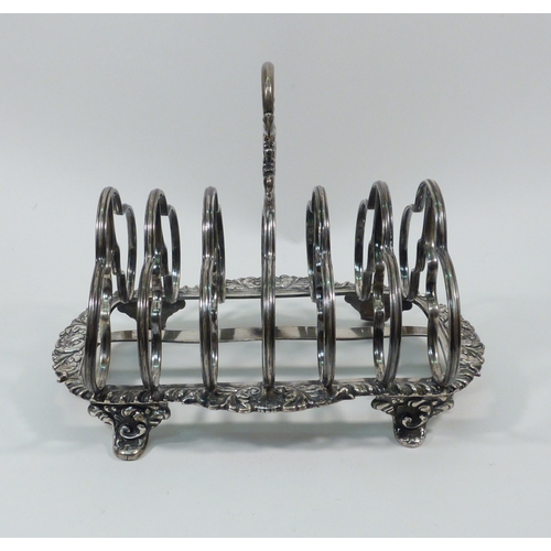 77 - A William IV silver toast rack, Howard, Battie & Hawksworth, Sheffield 1829.  Approx 180mm long/ 140... 