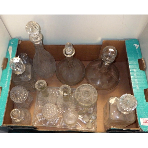 302 - A group of various decanters, dressing table set etc