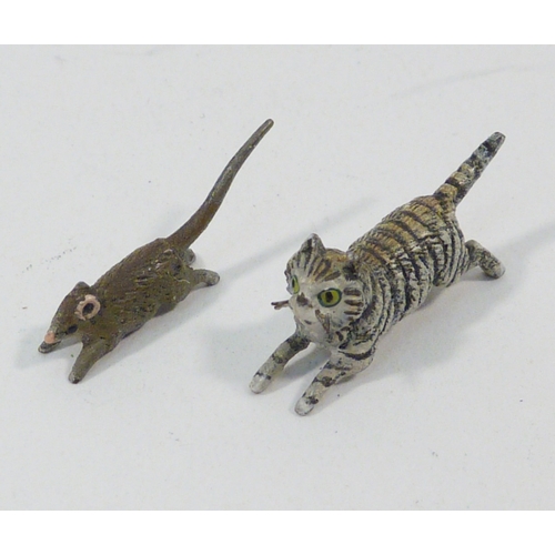 136 - A group of three cold painted bronze running rabbits, unsigned 65mm long; a cold painted bronze rat ... 