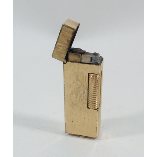 129 - A Dunhill Rollagas cigarette lighter, boxed with papers.