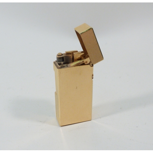 130 - A Dunhill Rollagas cigarette lighter, gold plated