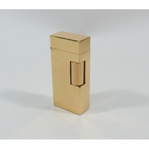 130 - A Dunhill Rollagas cigarette lighter, gold plated