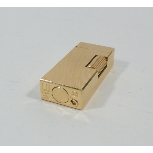 130 - A Dunhill Rollagas cigarette lighter, gold plated