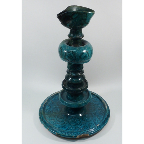 552 - A pottery oil burner lamp decorated with turquoise glaze, believed Persian, a/f.  Approx 350mm tall.