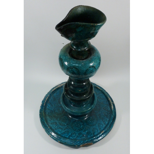 552 - A pottery oil burner lamp decorated with turquoise glaze, believed Persian, a/f.  Approx 350mm tall.