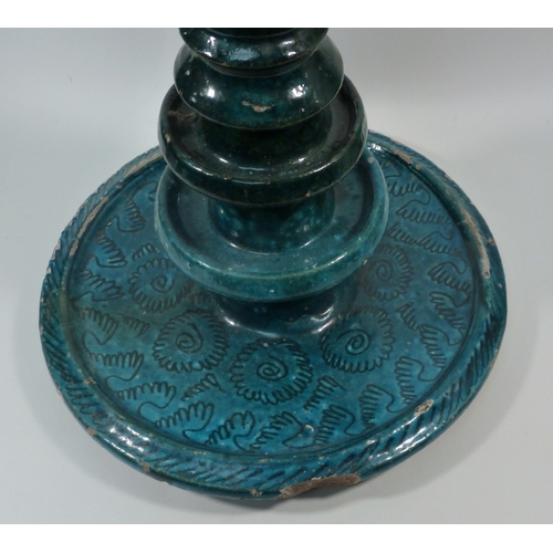 552 - A pottery oil burner lamp decorated with turquoise glaze, believed Persian, a/f.  Approx 350mm tall.