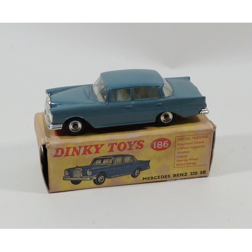 554 - A Dinky Toys Mercedes Benz 220 SE in teal blue, model 186.  Boxed.