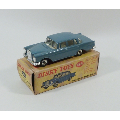 554 - A Dinky Toys Mercedes Benz 220 SE in teal blue, model 186.  Boxed.