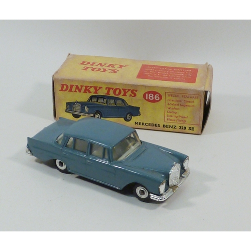 554 - A Dinky Toys Mercedes Benz 220 SE in teal blue, model 186.  Boxed.