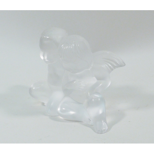 140 - A Lalique girl & boy angel paperweight, a/f chipped.  82mm tall.