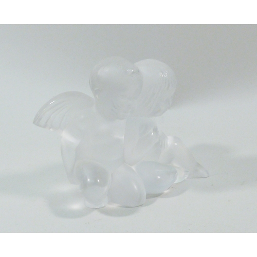 140 - A Lalique girl & boy angel paperweight, a/f chipped.  82mm tall.